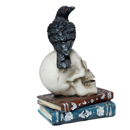 Dekofigur Krähe stehend auf Totenkopf und Büchern
